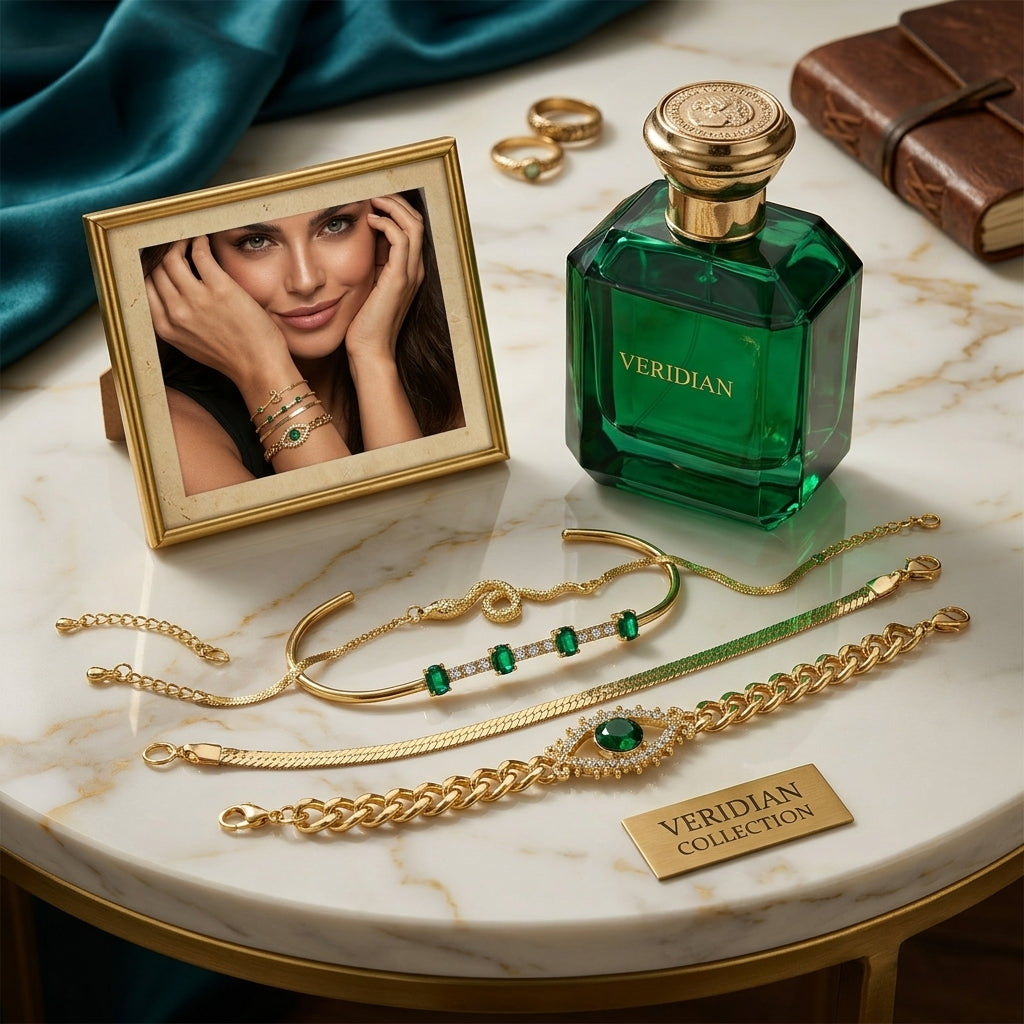 Veridian jewelry and perfume set on a marble surface with a photo frame and books.