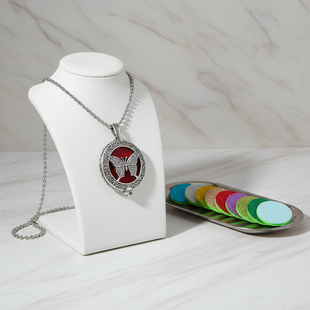 Butterfly pendant necklace with a row of colorful felt pads on a white background