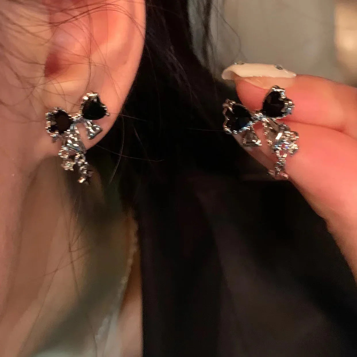 Elegant black gemstone and silver floral earrings with sparkling accents