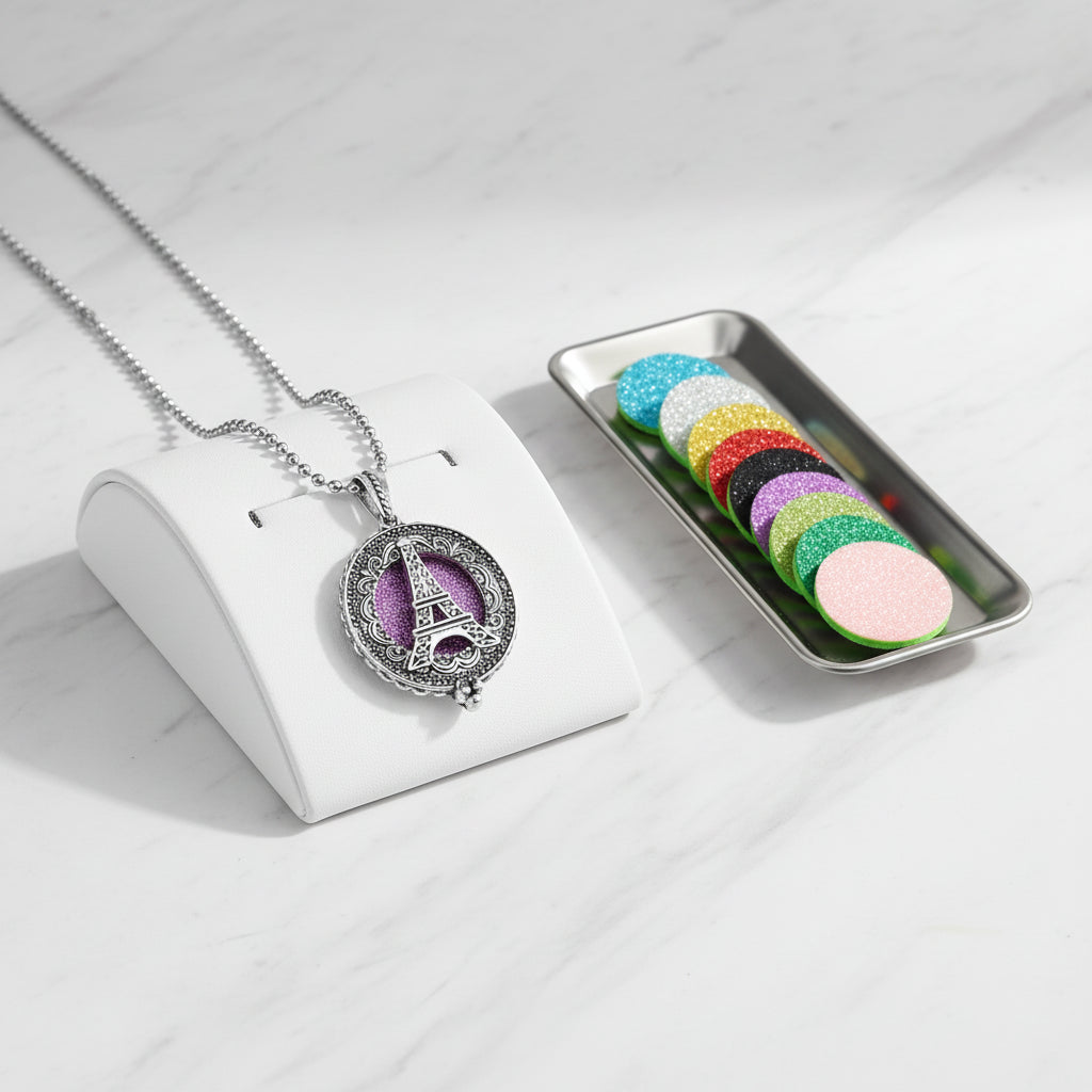 Necklace with Eiffel Tower pendant and colorful refills on a white background