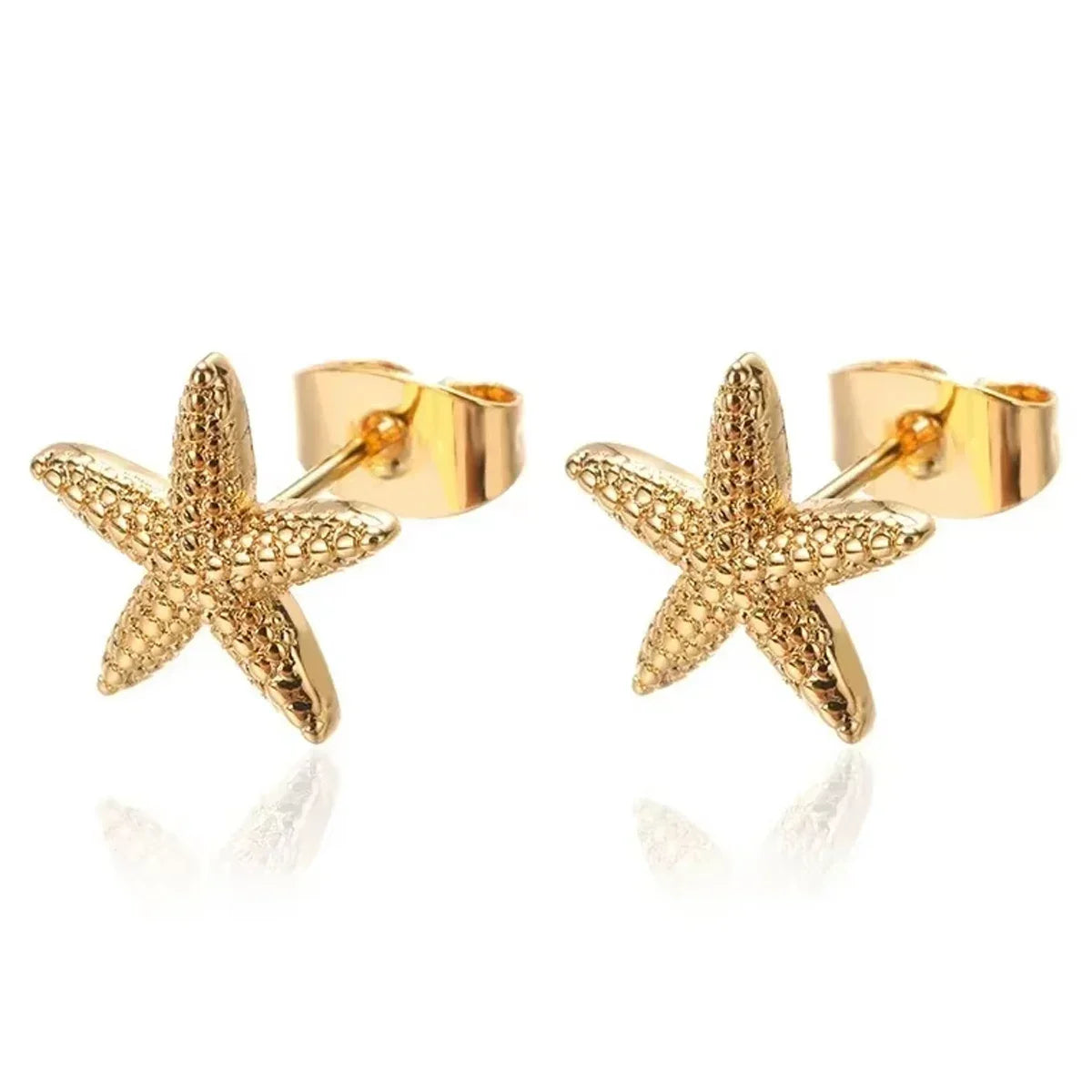 Gold starfish stud earrings, textured designer jewelry, modern elegant accessory