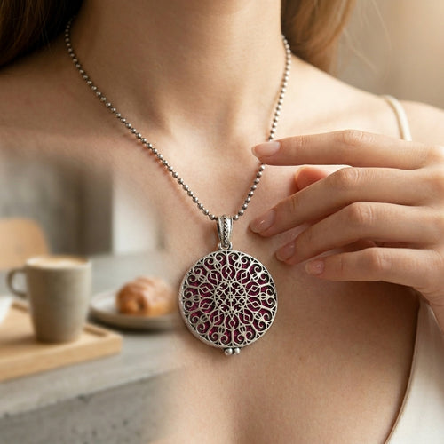 Close-up of a person wearing a decorative necklace with a blurred background